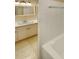 This bathroom features a single sink vanity and a white tiled bathtub at 6813 Linda Lake Dr, Charlotte, NC 28215