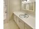 Bright bathroom with white cabinets, a mirror, and ample counter space at 6813 Linda Lake Dr, Charlotte, NC 28215