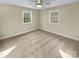 A vacant room featuring natural lighting and beige carpeting at 6813 Linda Lake Dr, Charlotte, NC 28215