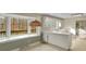 Kitchen with white cabinets, breakfast bar and large bay window to the backyard at 6813 Linda Lake Dr, Charlotte, NC 28215