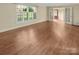Bright living room with wood floors, white trim, and a view of the outdoors at 6813 Linda Lake Dr, Charlotte, NC 28215