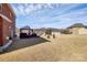 Expansive backyard featuring mature trees, a storage shed, and a spacious lawn for outdoor activities at 815 Oak Embers Se Dr, Concord, NC 28025