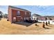 Spacious backyard features a patio with outdoor seating, perfect for entertaining or relaxing at 815 Oak Embers Se Dr, Concord, NC 28025