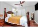 Bedroom featuring wooden floors, traditional furniture, fan, and natural light at 815 Oak Embers Se Dr, Concord, NC 28025
