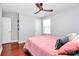 Bedroom with wooden floors, ceiling fan and natural light at 815 Oak Embers Se Dr, Concord, NC 28025