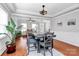 Open dining room with modern furnishings, natural light, and hardwood flooring at 815 Oak Embers Se Dr, Concord, NC 28025