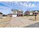 Suburban two-story home with a wide driveway, brick accents, well-maintained lawn, and inviting curb appeal at 815 Oak Embers Se Dr, Concord, NC 28025