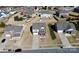 Aerial view showcases a well-manicured front lawn, two-car garage, and landscaped surroundings at 815 Oak Embers Se Dr, Concord, NC 28025