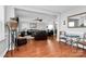 Spacious living area with hardwood floors and an open concept layout, perfect for entertaining at 815 Oak Embers Se Dr, Concord, NC 28025