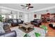 Elegant living room featuring hardwood floors, an open layout, and seamless integration with the dining and kitchen areas at 815 Oak Embers Se Dr, Concord, NC 28025