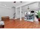 Open-concept living space showcasing hardwood floors, crown molding, and seamless transition to the dining area at 815 Oak Embers Se Dr, Concord, NC 28025