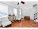 Inviting living area with hardwood floors, ample natural light, and staircase access at 815 Oak Embers Se Dr, Concord, NC 28025