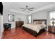 Spacious main bedroom suite with tray ceiling, hardwood floors, and ample natural light at 815 Oak Embers Se Dr, Concord, NC 28025