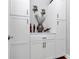 A pantry featuring white cabinets, wine storage, and decorative items, ideal for storing essentials at 815 Oak Embers Se Dr, Concord, NC 28025