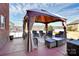 Covered patio area with comfortable seating, ideal for outdoor relaxation and entertaining guests at 815 Oak Embers Se Dr, Concord, NC 28025