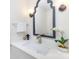 Stylish bathroom with modern vanity, updated faucet, and decorative mirror at 8322 Knights Bridge Rd, Charlotte, NC 28210
