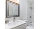 Modern bathroom features new vanity, sink, updated tiling, and shower at 8322 Knights Bridge Rd, Charlotte, NC 28210