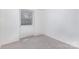 Cozy bedroom featuring neutral carpet, one window, and fresh white paint at 8322 Knights Bridge Rd, Charlotte, NC 28210