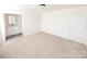 Bedroom featuring neutral walls, carpet, and attached bathroom at 8322 Knights Bridge Rd, Charlotte, NC 28210