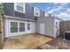 Exterior backyard featuring patio and gray siding at 8322 Knights Bridge Rd, Charlotte, NC 28210