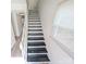 Staircase with black treads, white risers, and a bright window at 8322 Knights Bridge Rd, Charlotte, NC 28210