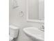 Powder room featuring a wall-mounted sink and toilet in a compact space at 840 Imperial Ct, Charlotte, NC 28273