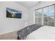 Cozy bedroom featuring neutral walls, carpet flooring, TV, and a window with natural light at 840 Imperial Ct, Charlotte, NC 28273