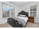 Cozy bedroom with neutral carpet, natural light, and a stylish black bed frame at 840 Imperial Ct, Charlotte, NC 28273