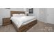 Bedroom featuring white walls, a wooden bed frame, and carpet flooring at 840 Imperial Ct, Charlotte, NC 28273