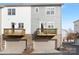 Townhome exterior featuring private decks and two-car garages at 840 Imperial Ct, Charlotte, NC 28273