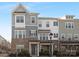 Charming two-story townhome boasts a brick facade, neutral siding, and well-manicured landscaping at 840 Imperial Ct, Charlotte, NC 28273