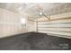 Spacious two-car garage with partially finished walls and a rubber-tile floor at 840 Imperial Ct, Charlotte, NC 28273