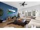 Bright living room with a blue accent wall, hardwood floors, and an entertainment center at 840 Imperial Ct, Charlotte, NC 28273