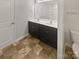 Well-lit bathroom with double sinks, ample counter space, and modern fixtures providing a functional design at 9154 Bradstreet Commons Way, Charlotte, NC 28215