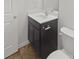 Bathroom showcasing a dark vanity with white countertop, complemented by a modern sink and fixtures at 9154 Bradstreet Commons Way, Charlotte, NC 28215