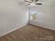 Bright bedroom with a ceiling fan and neutral carpet, offering a versatile space with natural light at 9154 Bradstreet Commons Way, Charlotte, NC 28215
