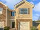 Charming townhouse with a one-car garage and stone and siding facade at 9154 Bradstreet Commons Way, Charlotte, NC 28215