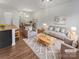 Bright and airy living room with stylish furnishings, decor, and open floor plan at 9154 Bradstreet Commons Way, Charlotte, NC 28215