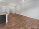 Spacious open-concept living area with hardwood floors and natural light at 9154 Bradstreet Commons Way, Charlotte, NC 28215