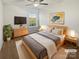 Serene bedroom featuring a comfortable bed, natural light, and minimalist decor at 9154 Bradstreet Commons Way, Charlotte, NC 28215