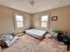Bedroom with two windows overlooking an unkempt lawn at 930 Weaver Rd, China Grove, NC 28023