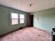 Bedroom featuring two windows and an open closet at 930 Weaver Rd, China Grove, NC 28023