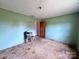 Bedroom featuring mint-colored walls and a view into another room at 930 Weaver Rd, China Grove, NC 28023
