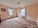 Bedroom with pink walls, carpet, and lots of light from the window at 930 Weaver Rd, China Grove, NC 28023