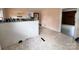 Corner view of an eat-in kitchen with white cabinetry, vintage decor, and a view to other rooms at 930 Weaver Rd, China Grove, NC 28023