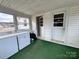 Enclosed porch with laundry hookups, providing a convenient and functional space at 930 Weaver Rd, China Grove, NC 28023