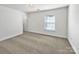Neutral bedroom with carpet flooring, ample light and closet space at 9407 Seamill Rd, Charlotte, NC 28278