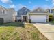 Charming two-story home with a two-car garage and well-maintained front yard at 9407 Seamill Rd, Charlotte, NC 28278