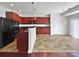 Spacious kitchen with dark cabinets, black appliances, and an open layout at 9407 Seamill Rd, Charlotte, NC 28278