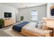 Serene bedroom with natural light, cozy rug, and modern furnishings at 9407 Seamill Rd, Charlotte, NC 28278